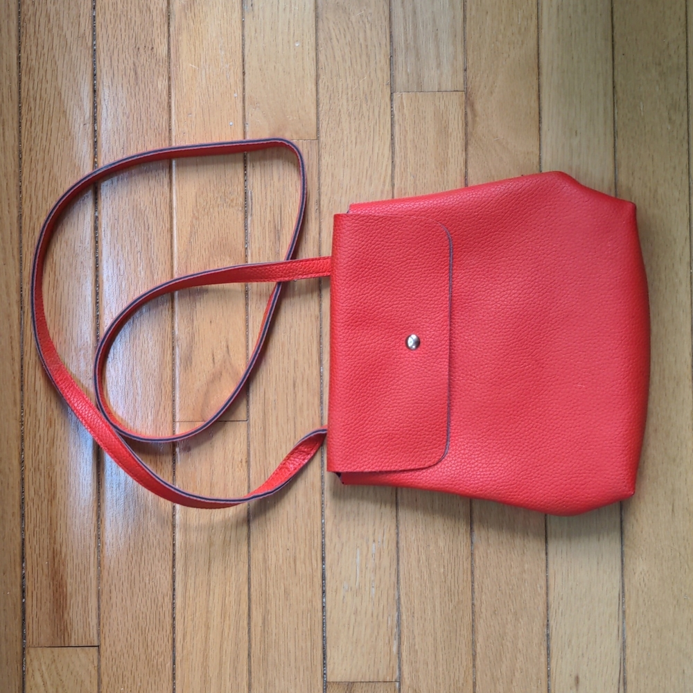 Red convertible crossbody / backpack bag